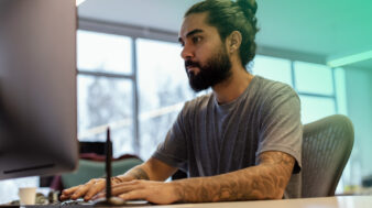 Picture of a man sitting with laptop